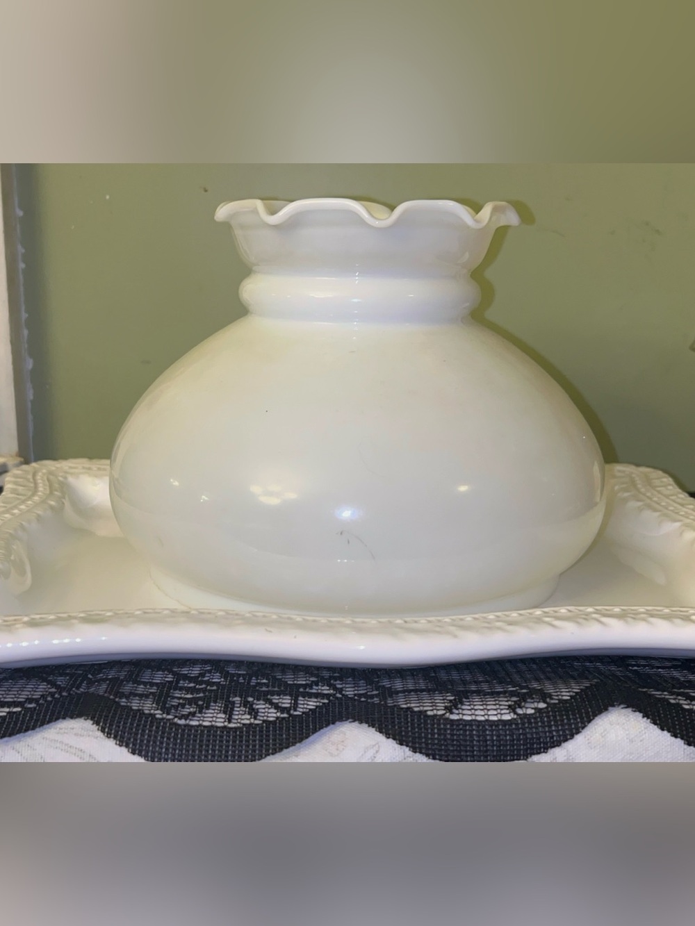 Milk glass student or hurricane lamp shade with a bulbous body and ruffled rim